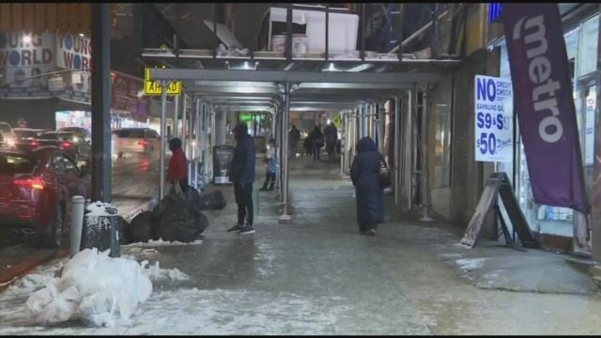 Snowfall creates slippery mess for commuters, pedestrians