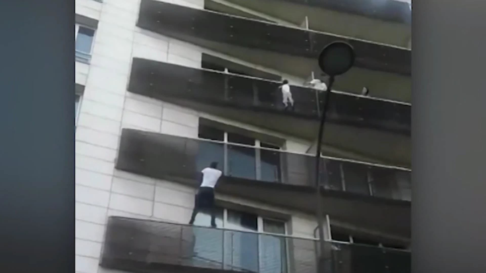 #N12BX: Man scales building to save dangling child