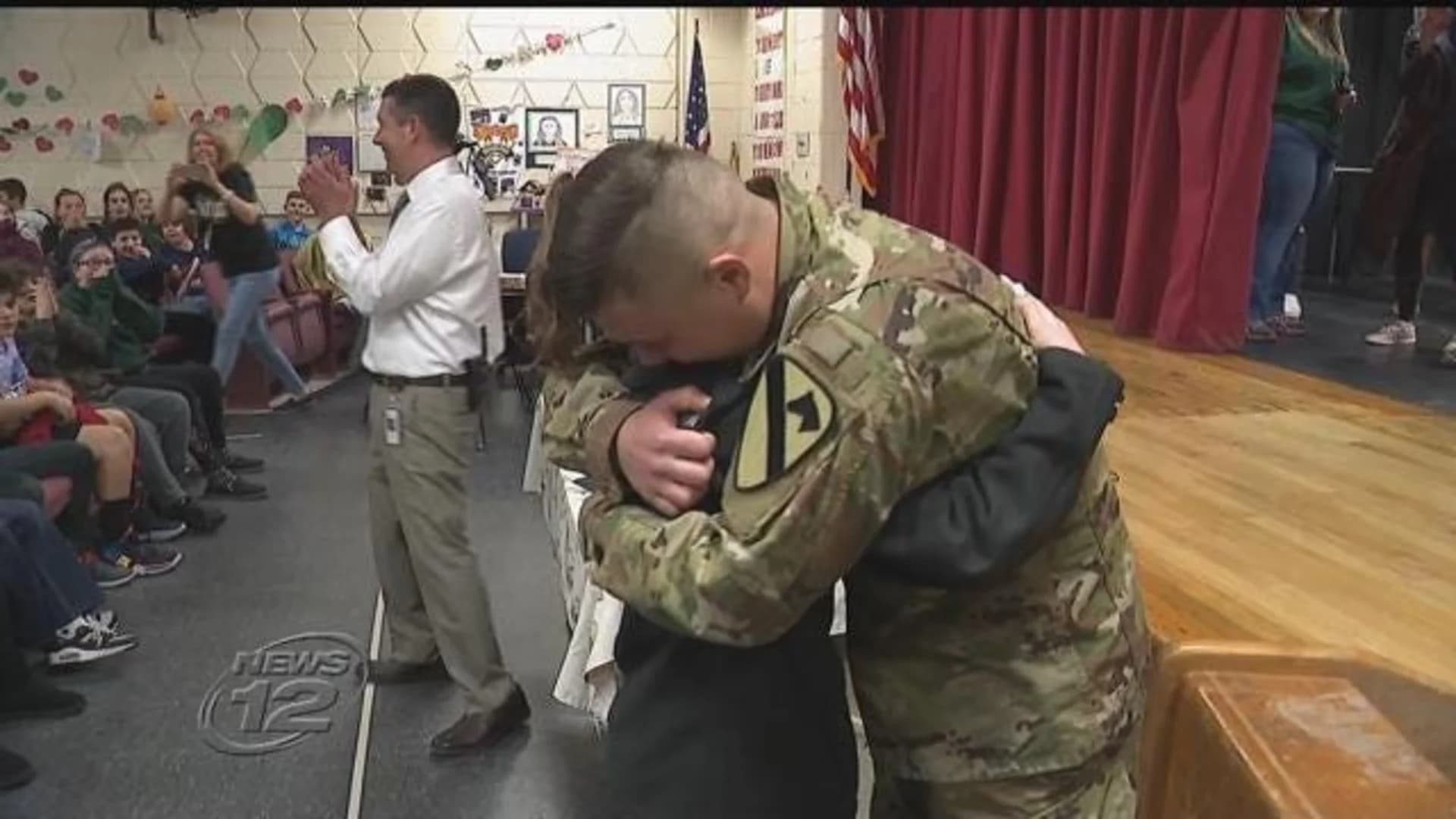 Military brother surprises younger sister at school assembly