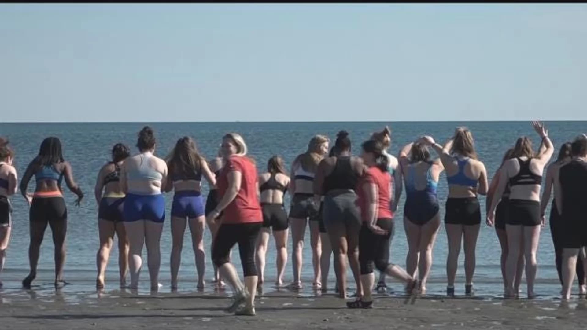 Rugby players take the ‘Rugger Plunge’ at Penfield Beach