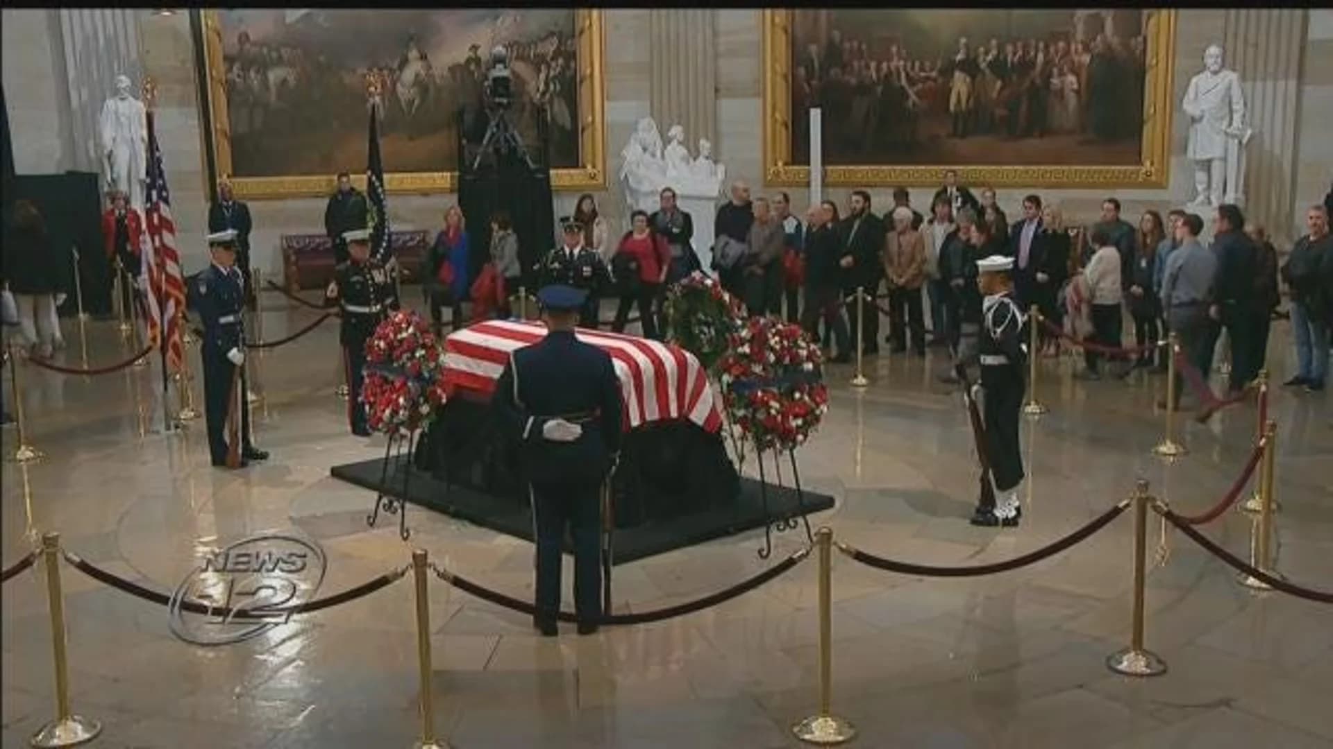 Bush saluted with praise, humor, cannons at capital farewell